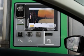 Øresund Bridge toll payment terminal showing Welcome to the Øresund Bridge screen with Assistance and Prices buttons, contactless card reader and QR code scanner